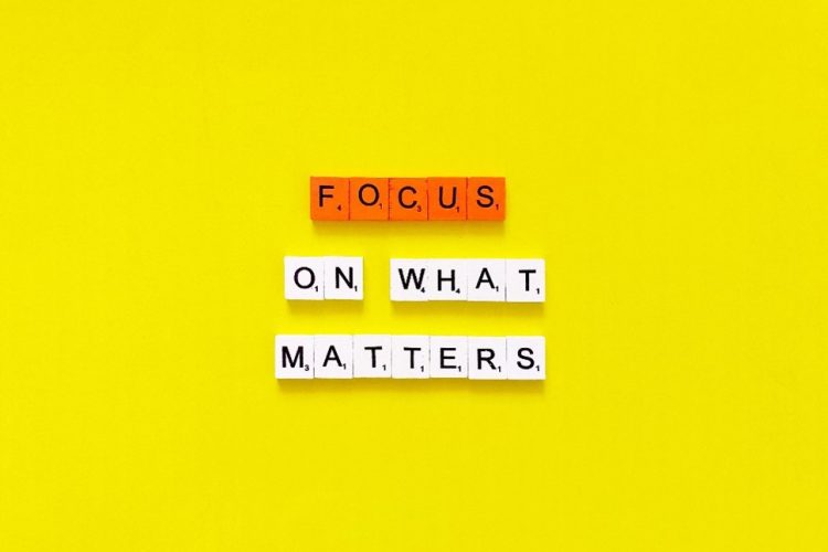 focus on what matters spelled on scrabble tiles