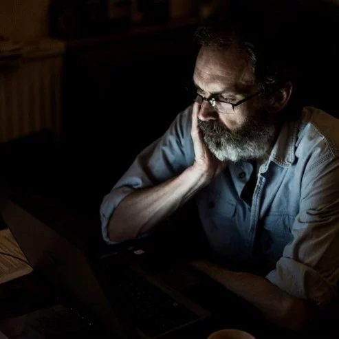 Leaders and problems - man worrying over problems in front of computer