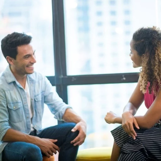 Gratitude and appreciation - two people smiling during a discussion